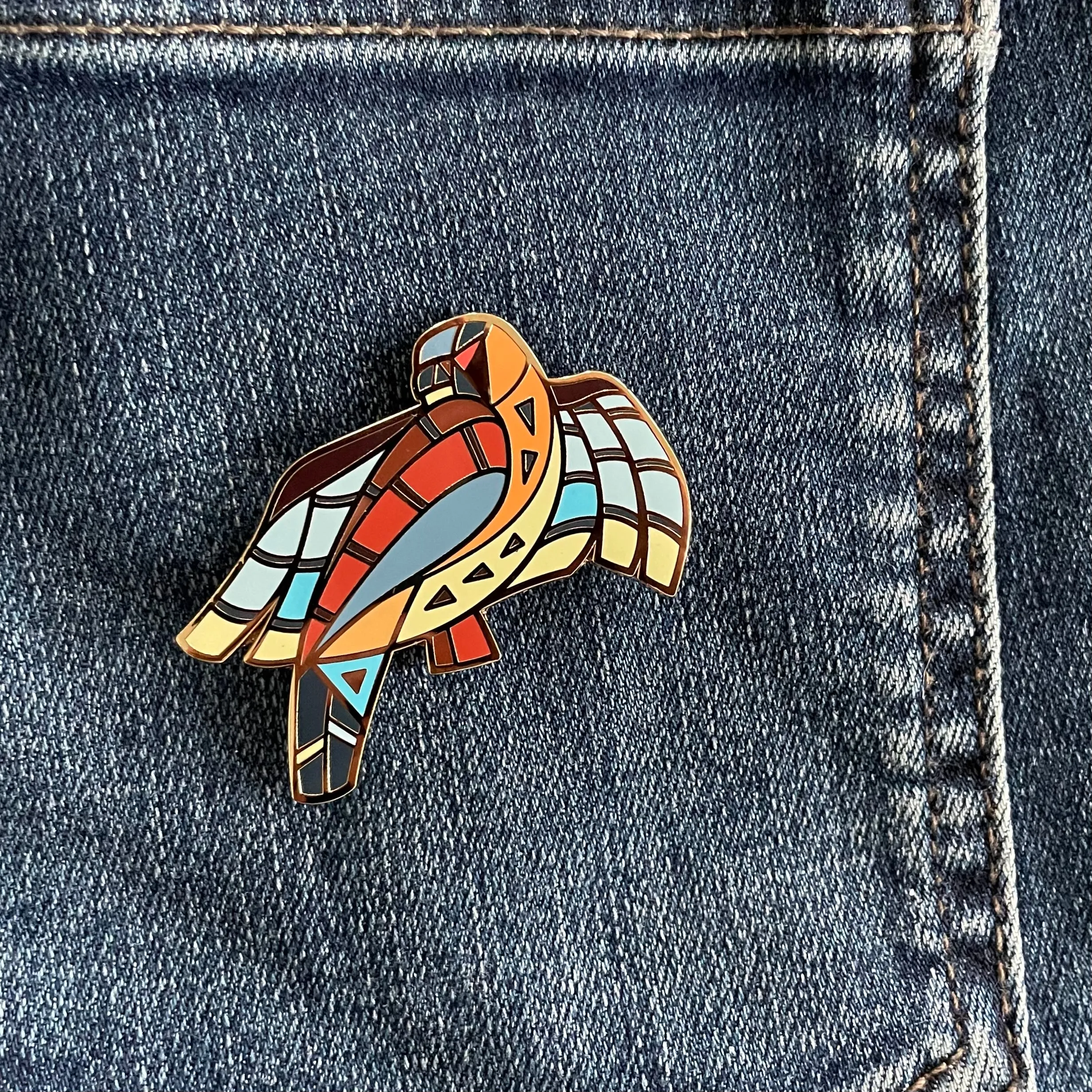 BeeKeeper Parade's Magical Patagonia Falcon Pin